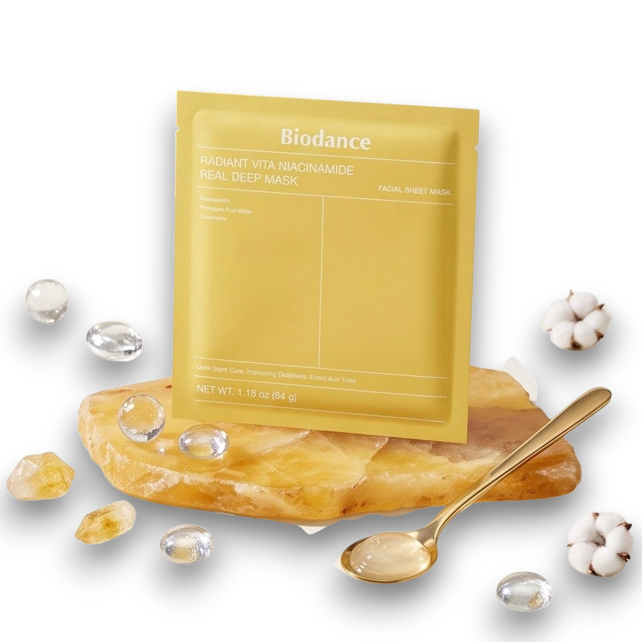 LuxNaura Biodance Radiant Vita Niacinamide hydrogel facial mask pack on a decorative stone with a gold spoon