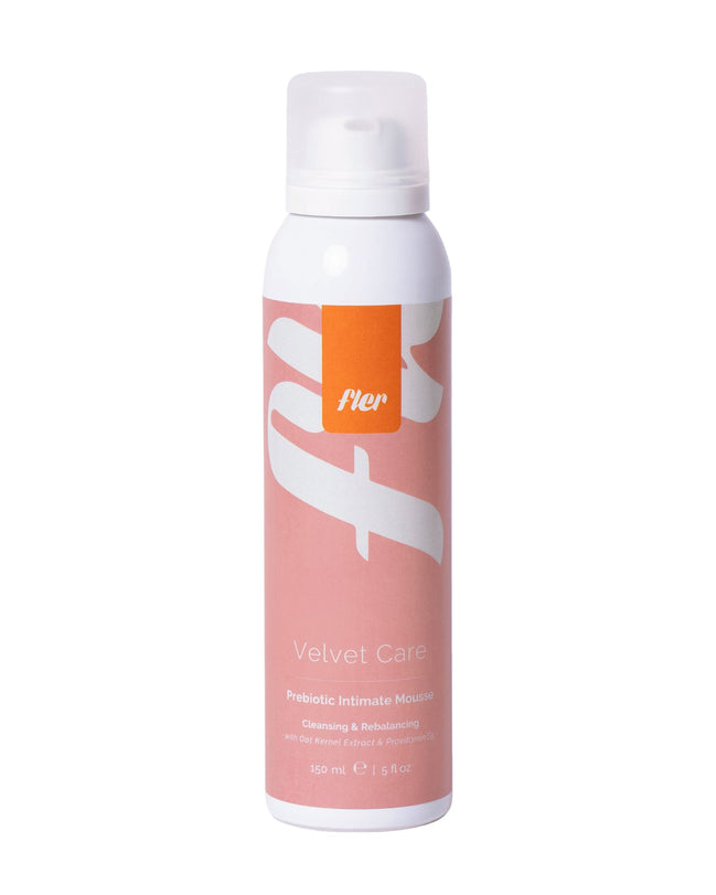 White spray bottle with pink label on a white background