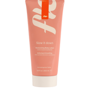 Pink tube of body lotion with white text on a white background