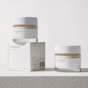Two jars of 'mixsoon' cream and its packaging on a light gray background