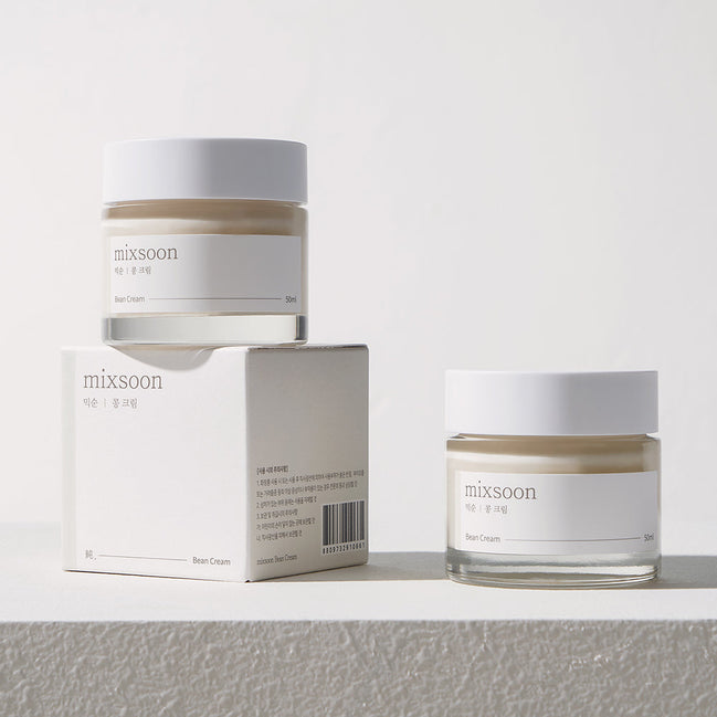Two jars of 'mixsoon' cream and its packaging on a light gray background