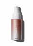 Pink spray bottle with white nozzle on a white background