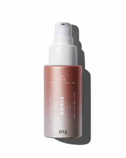 Pink spray bottle with white nozzle on a white background