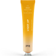 Orange tube of 'LIGHT UP' skincare product by PSA on a white background