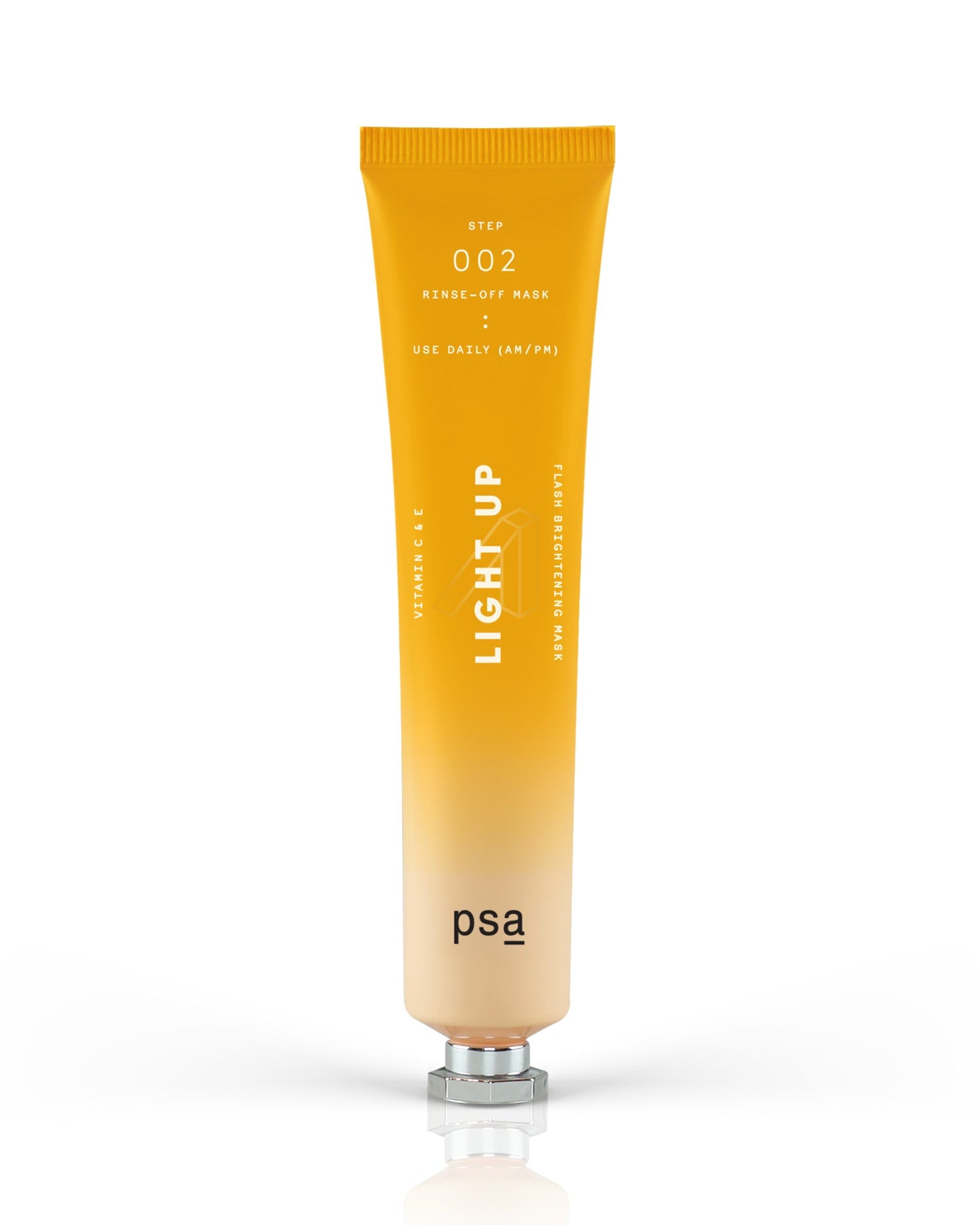 Orange tube of 'LIGHT UP' skincare product by PSA on a white background