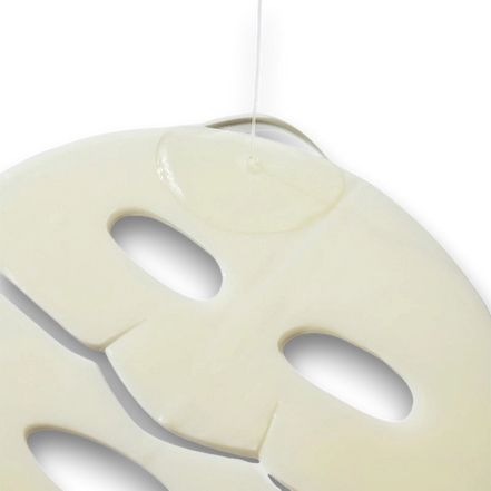 LuxNaura Biodance Radiant Vita Niacinamide hydrogel face mask with serum dripping onto the surface