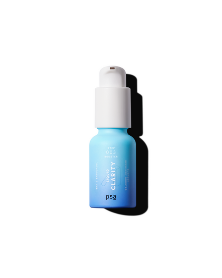 Blue serum bottle with white cap on a white background